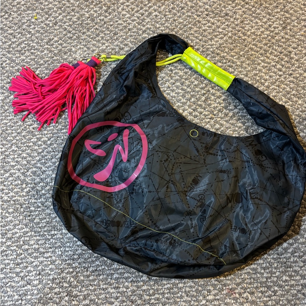 Zumba Fitness Black Hobo Bag with Pink Tassel and Neon Yellow Handle Accents